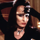 The Grand High Witch (Anjelica Huston) removes her mask.